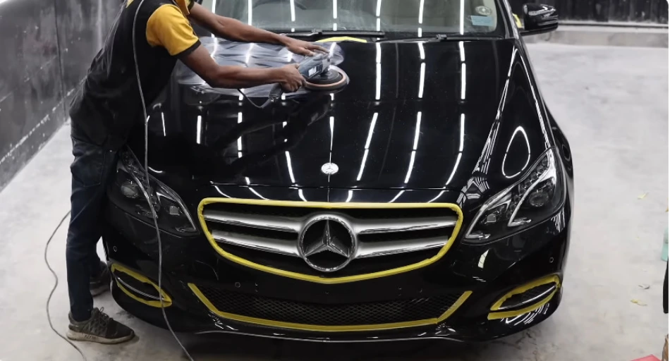 Technician machine polishing a car hood during paint correction and PPF prep in Bend, Oregon
